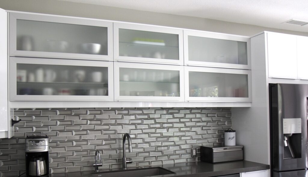 High gloss slab and aluminum frame Dendra Doors for kitchen remodel upper cabs