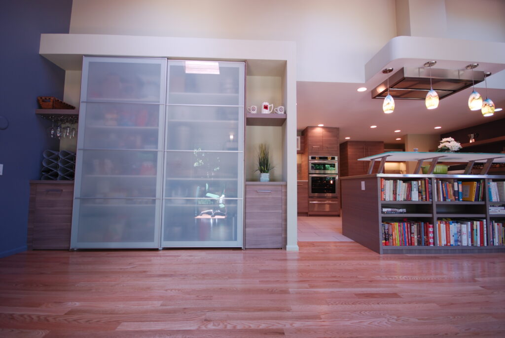 Prestwich walnut veneer floating shelves and doors with aluminum frame PAX fronts from Dendra Doors